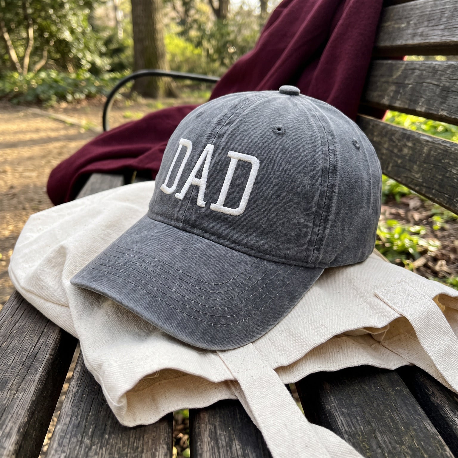 Grey DAD cap with a close view of the stitching