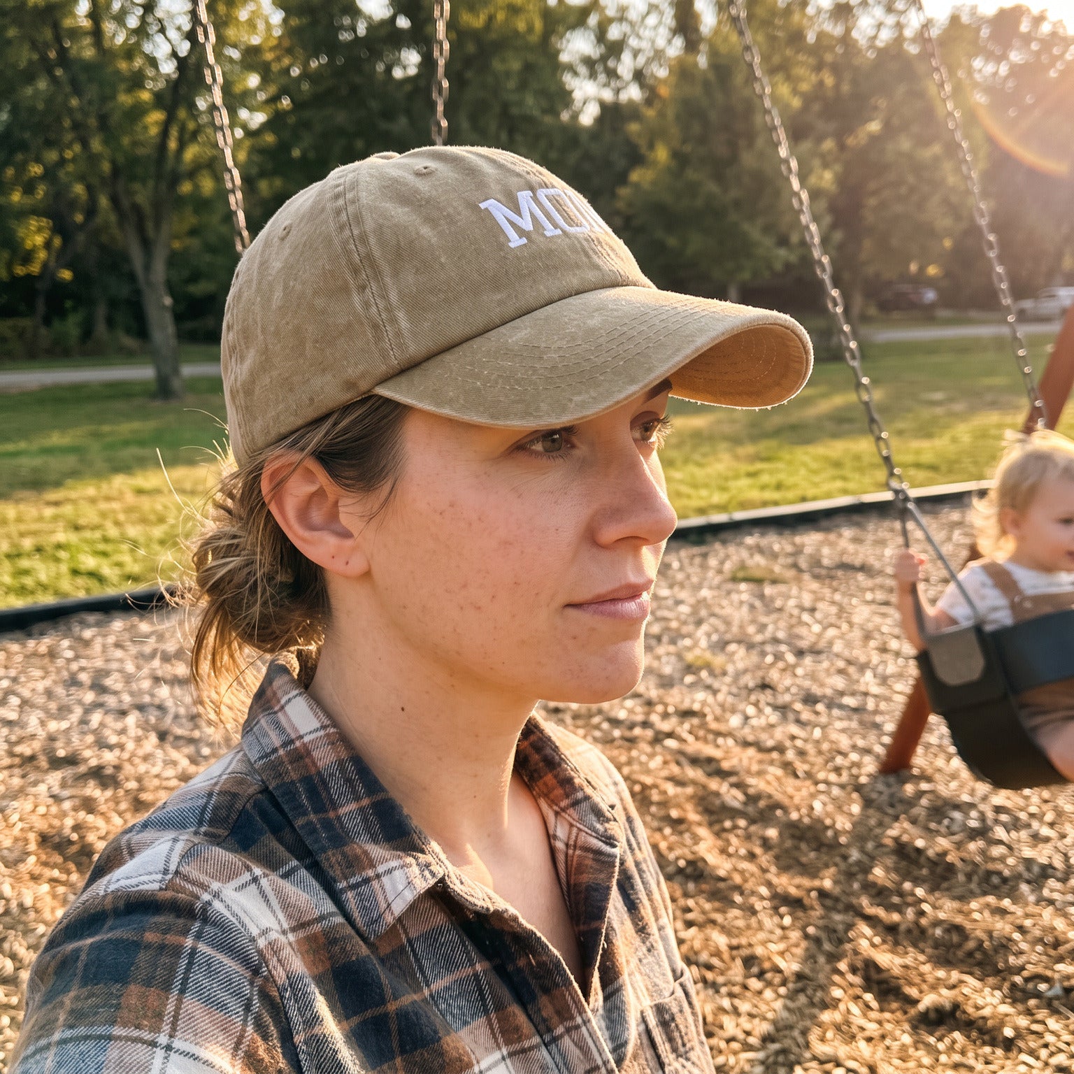 Mum wearing her Khaki MOM cap at the playground
